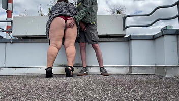 Spanking a sexy MILF&#039_s gorgeous fat ass while she jerks off my cock on the top of the parking lot