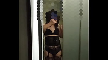 A transgender whore,  embodying characteristics associated with labels such as shemale,  tranny,  crossdresser,  tgirl,  sissy,  femboy,  or ladyboy,  she opens the restroom door,  revealing her sensual figure.