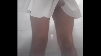 Plaidskirt ladyboy masturbating